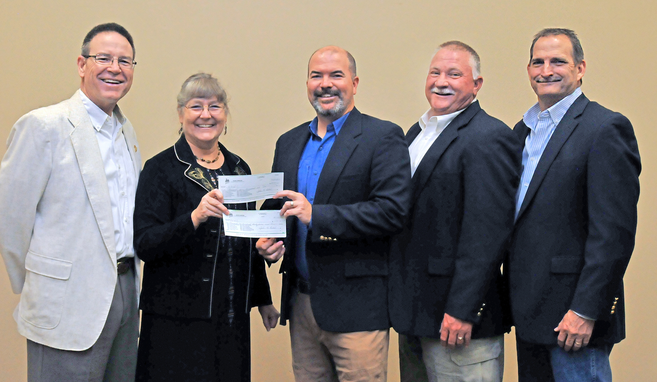 James Dietsch and Laura McIver, both of Quail Forever, present donations totalling $3,637 to ODWC Director J.D. Strong, Wildlife Chief Alan Peoples and Wildlife Assistant Chief Bill Dinkines. (Don P. Brown/ODWC)