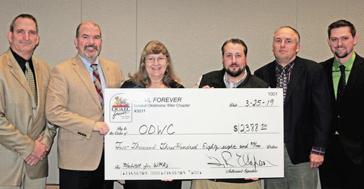 Gathered for a $2,388 donation for upland game management are, from left, Wildlife Assistant Chief Bill Dinkines, Director J.D. Strong, Laura McIver and John Bellah of Quail Forever, Assistant Director Wade Free and Upland Game Biologist Tell Judkins. (Photo by Don P. Brown/ODWC)