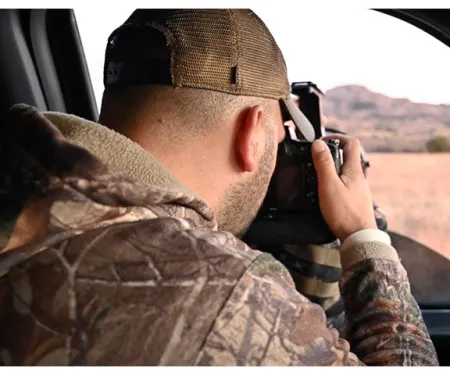 Jeremiah Zurenda combines skills of hunting and photography, shooting a camera out the window.