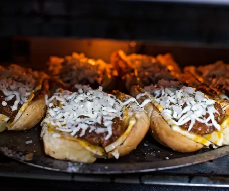 A photo of an elk Italian sandwich in the oven.