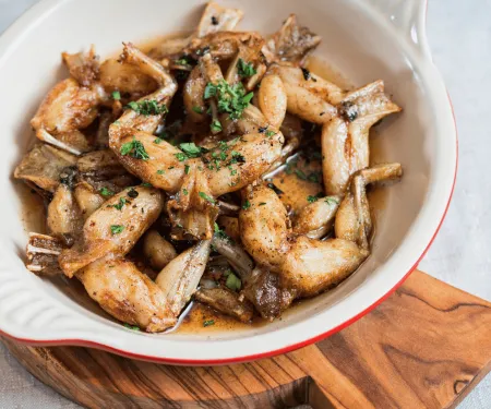 A bowl of fried frog legs.