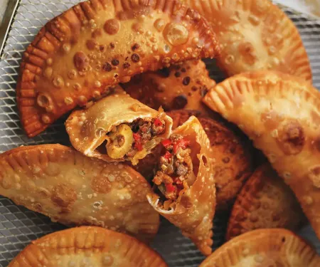 A pile of dove empanadas.