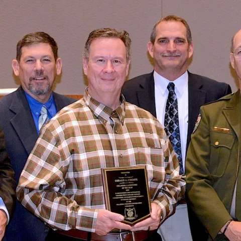 2019 Landowner Conservationist of the Year Award: J.D. Strong, Director-ODWC; Russ Horton, Research Supervisor; Gerald Choate, honoree; Bill Dinkines, Assistant Chief-Wildlife; Carlos Gomez, Game Warden; Wade Free, Assistant Director-ODWC.