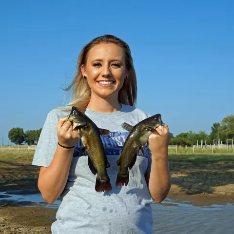 Girl holding bullhead catfish. Photo by Brandon Brown/ODWC