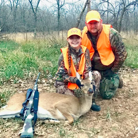 Natalee and Larry Heck with harvested deer.