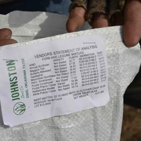 A tag on a bag of seed for flowering plants.