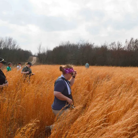 OKC Zoo surveying in field.