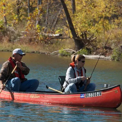 Man and woman in canoe.