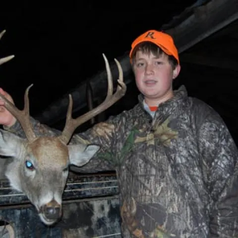 Youth boy with buck.