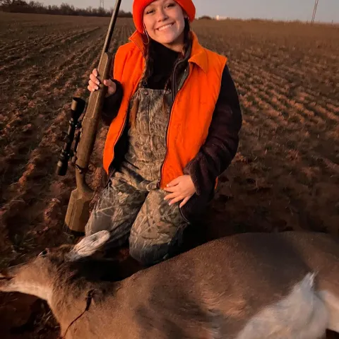 girl with harvested doe