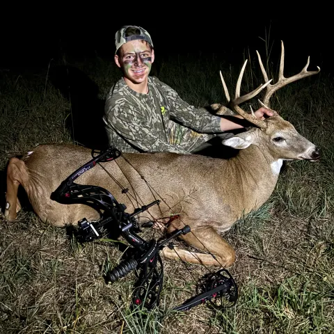 boy with archery buck