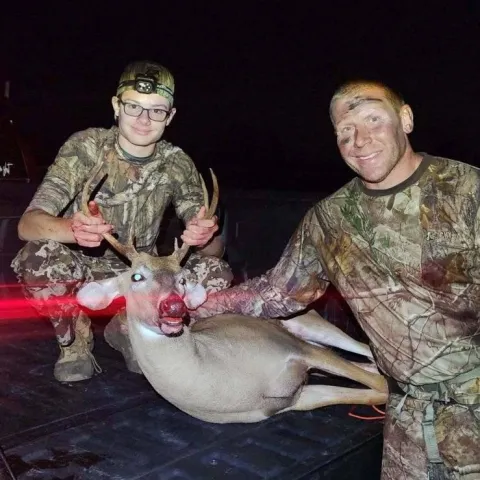 son and dad with buck