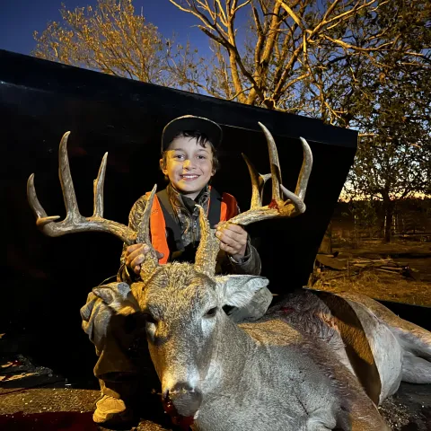 Boy with buck. Youth weekend