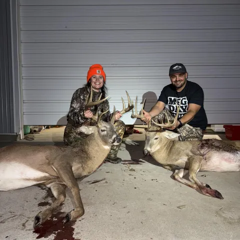 couple with 2 bucks