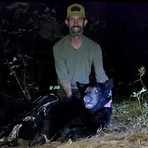 Terry Butler with his harvested Oklahoma bear.