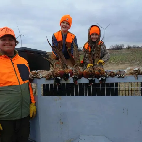 Keleigh Knight and friends with their harvested Oklahoma rabbits, quail, and pheasants.