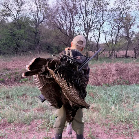 Sam R with his harvested Oklahoma wild turkey