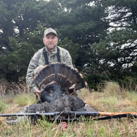 Jason Heckle with his harvested Oklahoma wild turkey