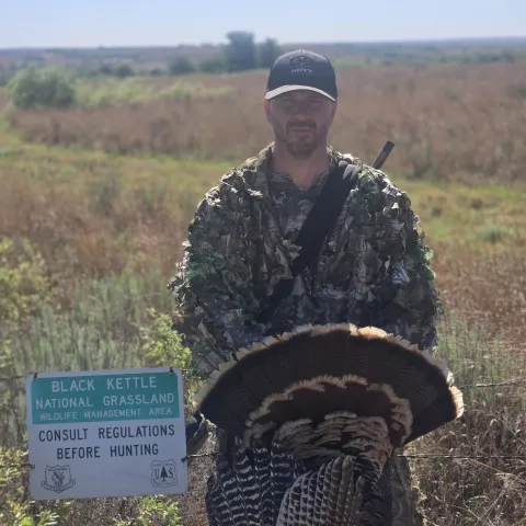Rory Davis with his harvested Oklahoma wild turkey