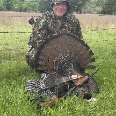 Christopher Maggio with his harvested Oklahoma wild turkey