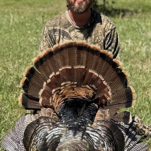 Mike Pearson with his harvested Oklahoma Wild Turkey