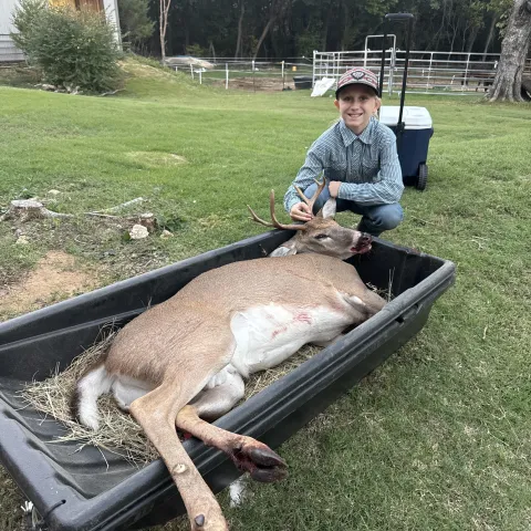 Ellie Taylor with her harvested Oklahoma White-tailed deer.