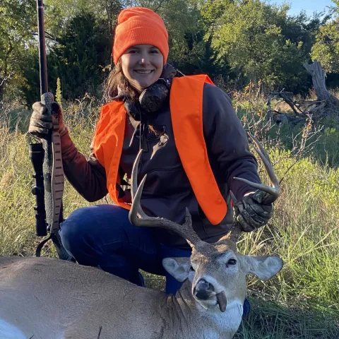 Addi McAlister with her harvested Oklahoma White-tailed deer.