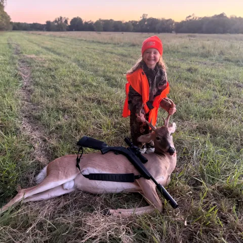 Annaleigh Tate with her harvested Oklahoma White-tailed deer.