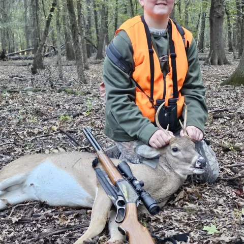 boy with harvested buck