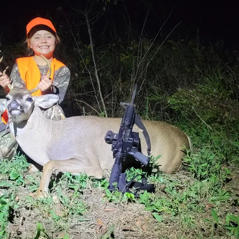 Madison Welch is pictured with her first harvest buck in Fall 2023, Oklahoma hunting.
