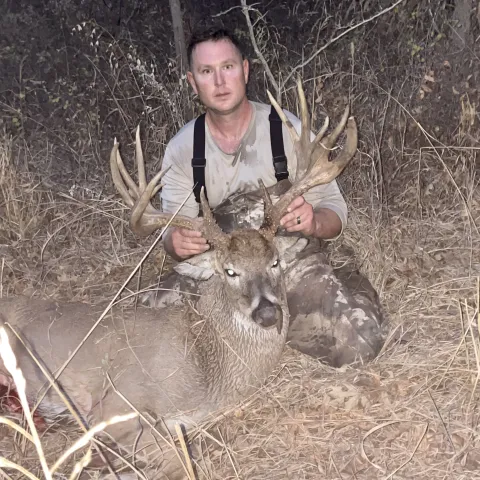 Hunter pictured with harvested deer.