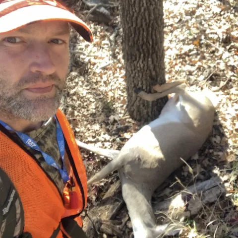 Hunter is pictured with harvested deer.