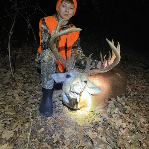 Young hunter pictured with first buck.