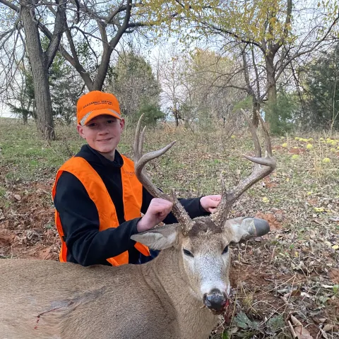 Young hunter pictured with his third harvested deer.