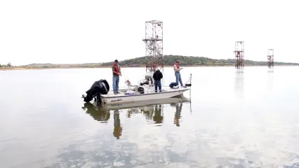 People on a boat fishing Kaw Lake