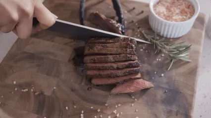 cutting deer meat photo