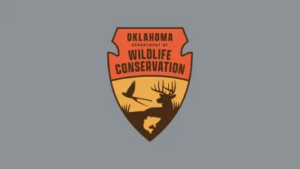 The Oklahoma Department of Wildlife Conservation logo sits in the center with a grey background.