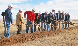 Supporters turn dirt during a groundbreaking ceremony for the Oklahoma Panhandle State University shooting sports complex. (MEGHAN GATES/OPSU)