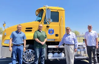 Groendyke Transport Inc. of Enid donated a 2013 Mack Trucks semi-tractor to the Wildlife Department's Fisheries Division. Gathered for the presentation are, from left, Chas Patterson, Northwest Region Fisheries Supervisor; Colby Rowe, heavy equipment operator; John D. Groendyke, CEO of Groendyke Transport Inc.; and Barry Bolton, Fisheries Chief. (ODWC Photo)