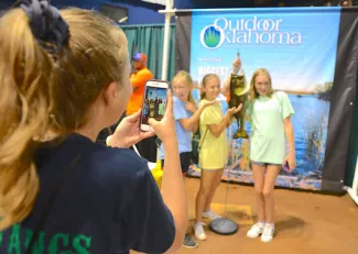 A group of girls pose for a photo at the wildlife expo