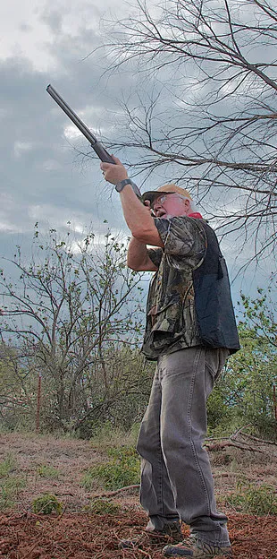 Man aiming a shotgun