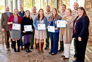 From left, ODWC Director J.D. Strong, Wildlife Resource Professional class of 2022 members Whitney Jenkins, Darrin Hill, Becky Rouner, Mark Hannah, Amanda Thomas, Billy Bob Walker, Rebecca Fillmore, Cody Youngblood, Mikki Wilmoth and Michael  Zimmerman, and WRP coordinator Karla Beatty. 