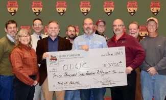 Gathered to present a $3,750 donation from Central Oklahoma 89er Quail Forever chapter are, from left, Russ Horton (ODWC), Laura McIver, James Dietsch, Kevin Bennett, John Bellah, J.D. Strong (ODWC), Chuck Pfeiffer, Troy Ellefson, Jeffrey Hawkins, and John Brinska.