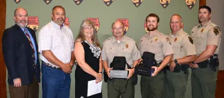 Gathered for a $5,000 donation from Red Bud Chapter of Quail Forever to ODWC's Law Enforcement Division are, from left, ODWC Director J.D. Strong, Clifton McKenzie of the Red Bud Chapter; Laura McIver, QF regional representative; Game Warden Mike France, Game Warden Jacob Harriett; Col. Nathan Erdman, Chief of Law Enforcement; and Lt. Col. Wade Farrar, Assistant Chief of Law Enforcement.