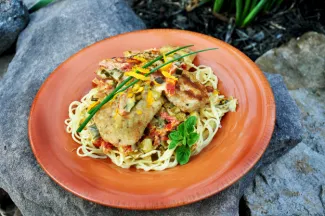 Bass over angel hair pasta with citrus cream sauce