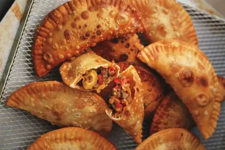 A pile of dove empanadas.