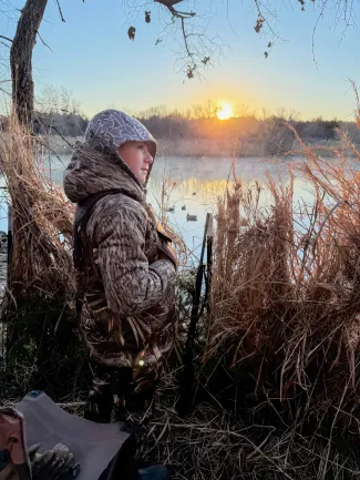 young boy duck hunting