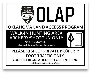 A black and white OLAP sign, Walk-in Hunting Area: Archery/Shotgun Only.